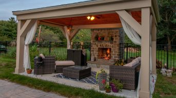 Cabana / lounge outdoor with fire in fireplace creating a relaxe